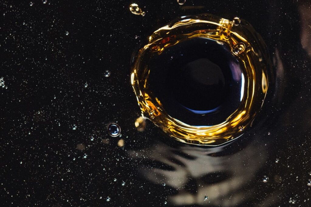 Crafting Captivating Headlines: Your awesome post title goes here >Closeup of water funnel and splashes created by drop on bubbling surface as background